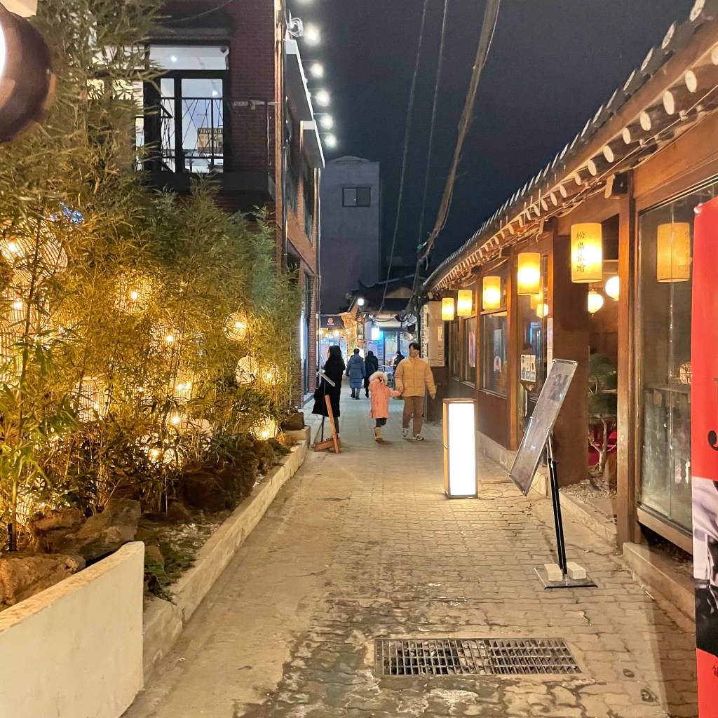 Romantic night out in Ikseon-dong with traditional hanok buildings and ambient lighting